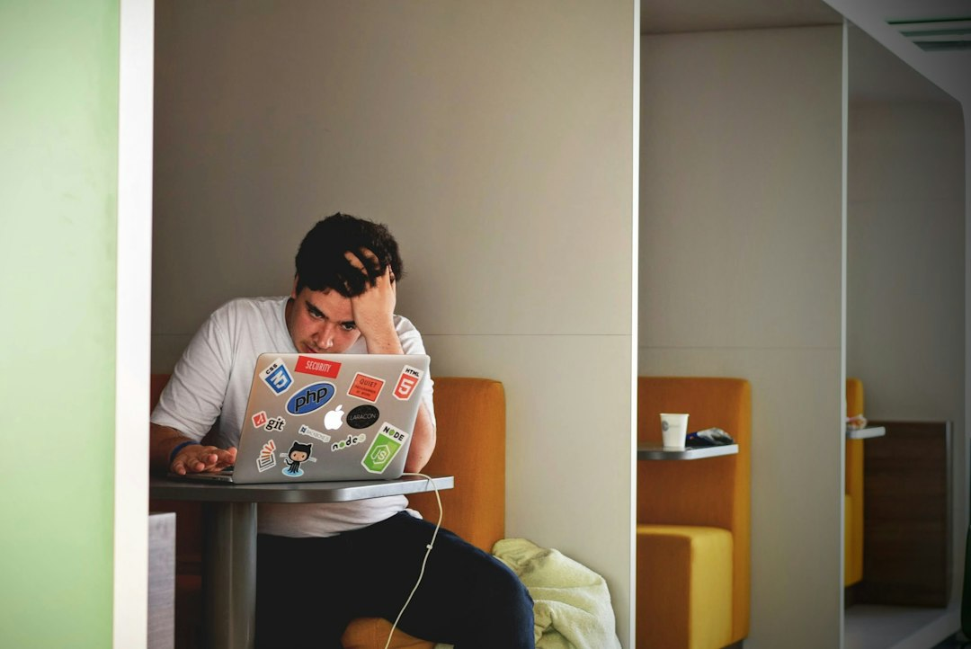 Person concentrating at a table, representing focused attention during decision-making
