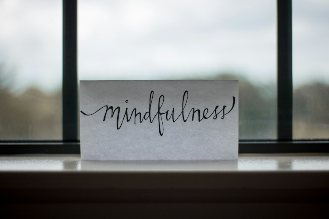 Person in a quiet reflective moment, representing attention and mindset.